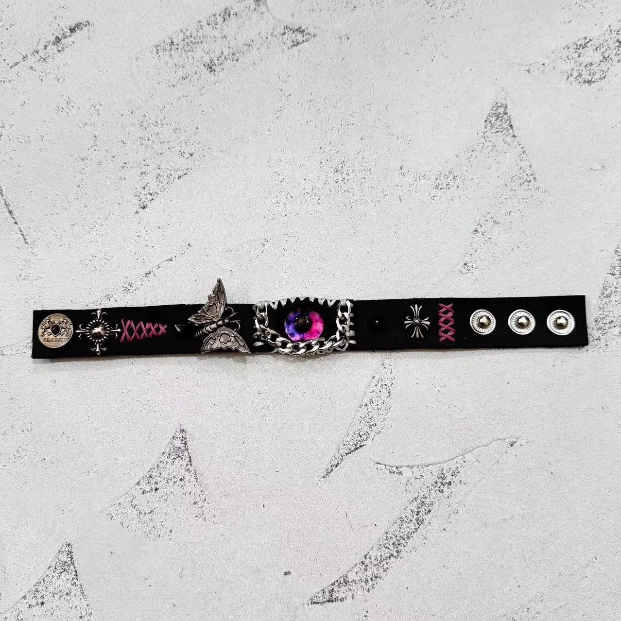 Gothic Black Leather Bracelet with Pink Stitching - Pink Dragon Eye & Silver Moth Cuff - Cross Charm - Pastel Goth Aesthetic