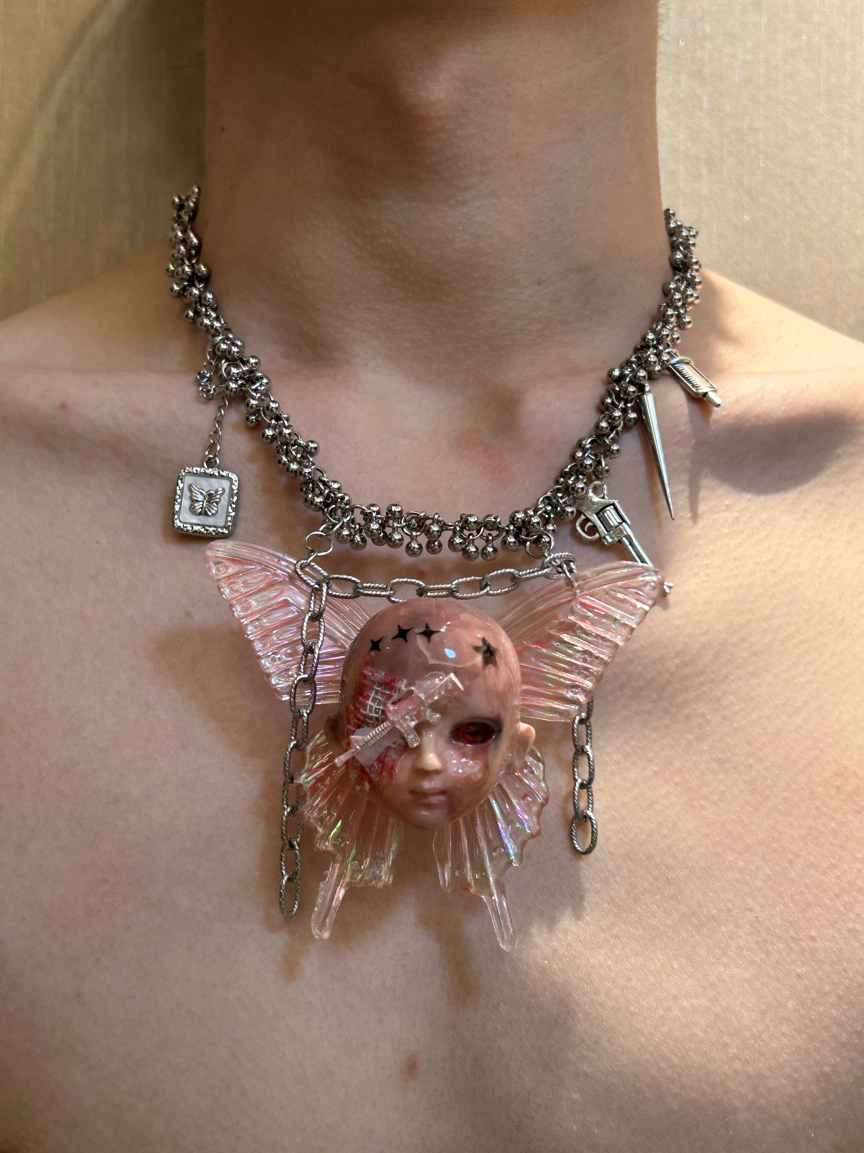 Holographic Pink Butterfly Injured Doll Necklace - Syringe & Revolver Charms