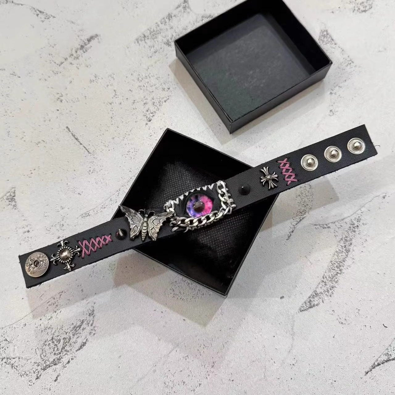 Gothic Black Leather Bracelet with Pink Stitching - Pink Dragon Eye & Silver Moth Cuff - Cross Charm - Pastel Goth Aesthetic