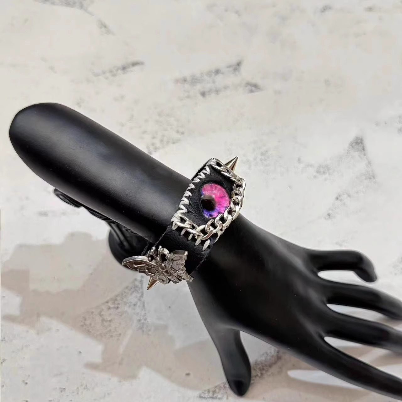 Gothic Black Leather Bracelet with Pink Stitching - Pink Dragon Eye & Silver Moth Cuff - Cross Charm - Pastel Goth Aesthetic
