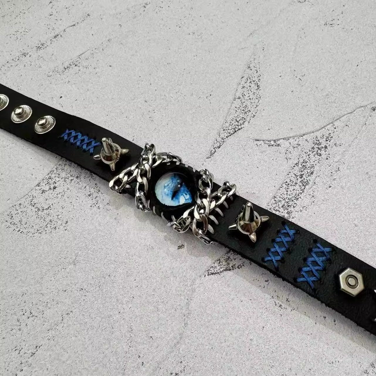 Gothic Black Leather Blue Dragon Eye Bracelet - Spiked Chain Cuff - Electric Blue Pupil Wristband - Cyberpunk Aesthetic