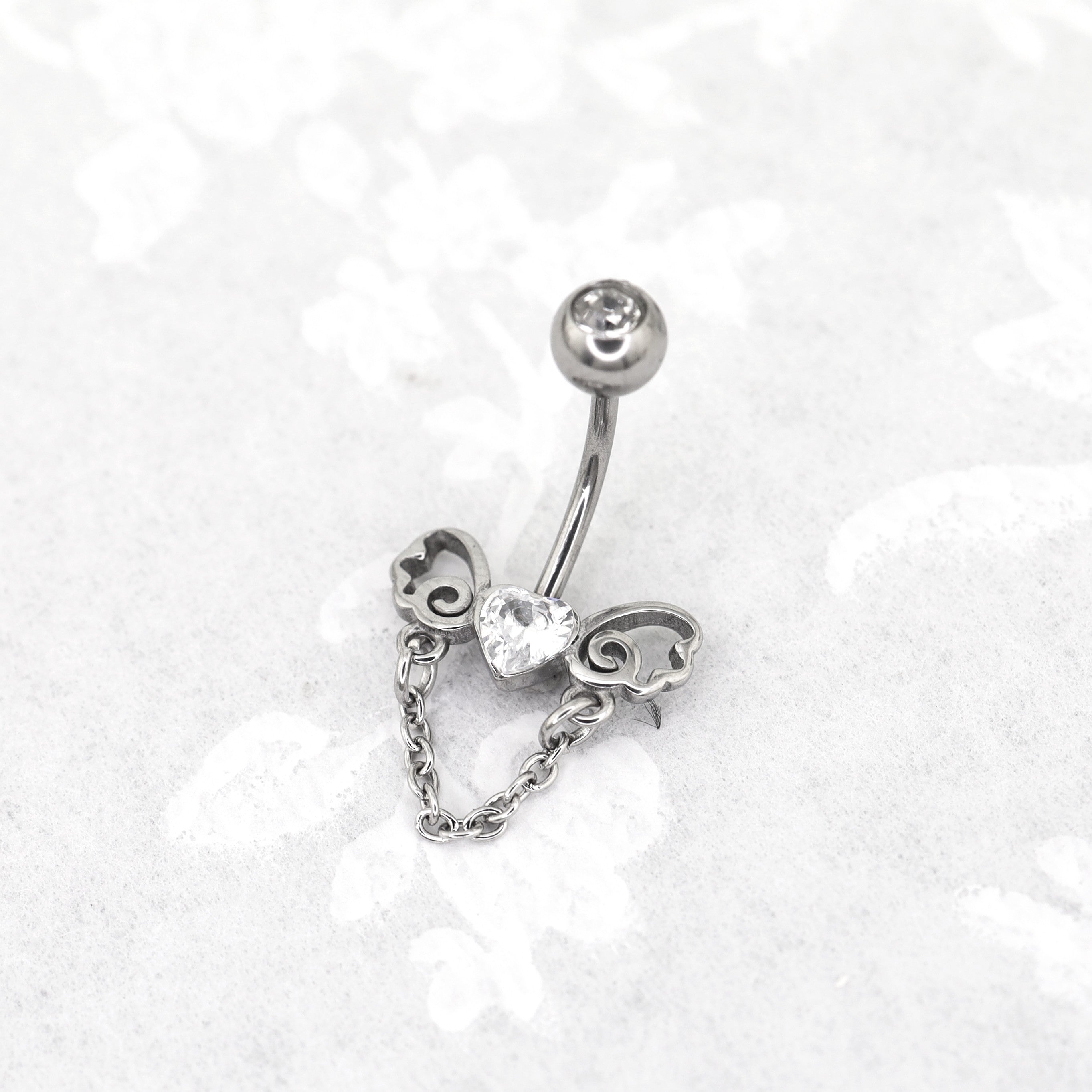 Heart-shaped CZ bow tie Dangle Belly Ring